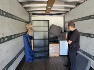 Good place Mover loading boxes and other items in moving truck